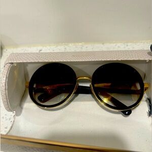 Woman’s Jimmy Choo Sunglasses.